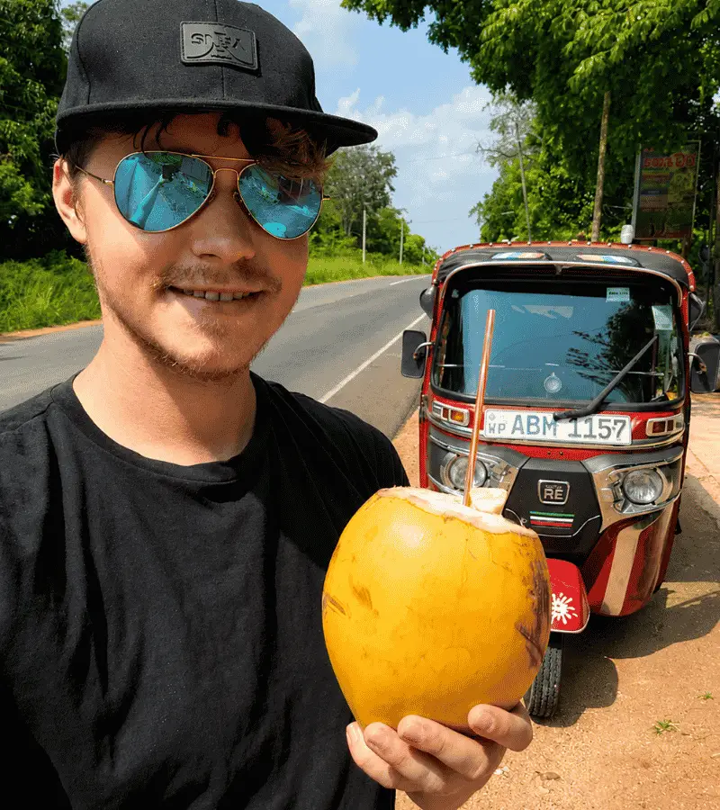 King coconut being sold from a roadside cart in Sri Lanka — one of the most refreshing tropical drinks on the island